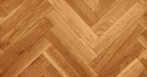 texture de parquet en bois en chevron ou baton rompu